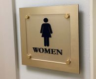 MEN & WOMEN – Satin Brass Metalike™ Panel with Frosted Acrylic ADA Compliant Panel for Haverford Trust Company in Radnor, PA